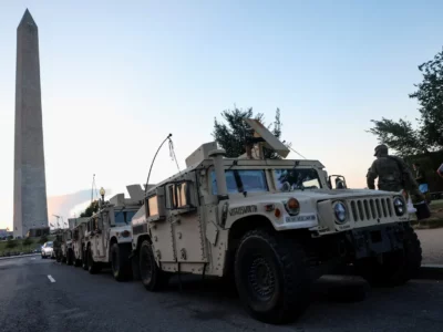 Original Photo from the Guardian US of Armoured Vehicles parked under George Washington’s Memorial. August 17, 2025